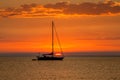 Sailboat at anchor with beautiful sunset in the background