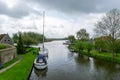 Sailboat at anchor in the canals near Sloten Royalty Free Stock Photo