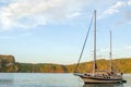 Sailboat at anchorage in beautiful bay at sunset Royalty Free Stock Photo