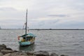 anchored sailboat on jakarta beach Royalty Free Stock Photo