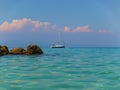 Sailboat anchored in the turquoise waters of The Aegean Sea at Kallithea, Greece