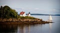 Sailboat approaches Lighthouse