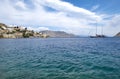 A Sailboat Approaching the Harbor of Symi, Greece