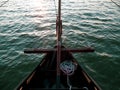 Sailboat bow with mooring rope sailing on the sea waves with turquoise water top view. Atmospheric marine travel photo Royalty Free Stock Photo