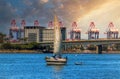 Sailboat captured floating on a scenic seascape in Long Beach, California at sunset