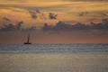 Sailboat, clouds and calm sea