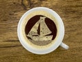 Sailboat in the coffee cup Royalty Free Stock Photo