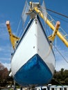 Sailboat on crane Royalty Free Stock Photo