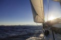 Sailboat crop during the regatta at sunset ocean Royalty Free Stock Photo