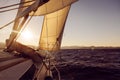 Sailboat crop during the regatta at sunset ocean Royalty Free Stock Photo