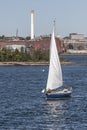 Sailboat crossing New Bedford inner harbor under sail