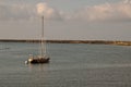 A sailboat moored in a bay Royalty Free Stock Photo