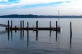 Sailboat docked at a pier with blue cloudy sky Royalty Free Stock Photo