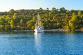 A sailboat enjoys a sunny summer late afternoon along the Dalmatian Coast of Croatia near Korcula Royalty Free Stock Photo