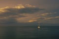 A sailboat enters the port of Rimini, Italy