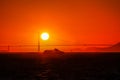 A sailboat and a ferryboat crossing the San Francisco Bay at sunset with the Golden Gate Bridge in the background. Royalty Free Stock Photo