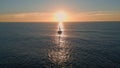 Sailboat floating ocean sunset drone view. Silhouette sailing boat at sunlight Royalty Free Stock Photo