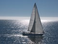 Sailboat gliding on calm sea Royalty Free Stock Photo