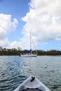 Sailboat gliding through Wiggins Pass in the Delnor Wiggins State Park waterway