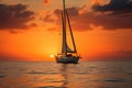 Sailboat gracefully sails on calm waters under the golden evening sky