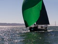 Sailboat with green spinnakers at Rolex Cup