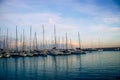 Sailboat harbor in the port evening photo. Beautiful moored sail yachts in the sea, Catalonia. Bright sunset and dusk Royalty Free Stock Photo