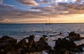 Sailboat and Hawaiian sunset on island of Maui Royalty Free Stock Photo