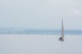 Sailboat Hazy Foggy Lake Morning Sailing Alone Loneliness on Water Royalty Free Stock Photo