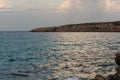 Sailboat heading north on a sunny morning at Punta Prima on the Island of Formentera, Spain