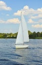 Sailboat heading to sea Royalty Free Stock Photo