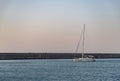 Sailboat at the Heraklion Breakwater at Sunset Royalty Free Stock Photo