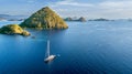 Sailboat with island under blue sky Royalty Free Stock Photo