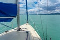 Sailboat on the lake Balaton ship prow view and other sailboats in the background Royalty Free Stock Photo