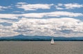 Sailboat, Lake Champlain, Vermont with white clouds