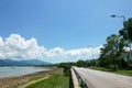 Sailboat, lake, road in the countryside with clean sky