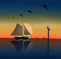 A sailboat with a man and a woman is seen on the ocean at sunset as pelicans fly