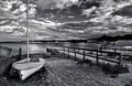 Sailboat on marine beach under a stormy sky