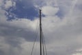 Sailboat mast in port and clouds Royalty Free Stock Photo