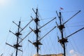 Sailboat masts against the blue sky. Symbol of adventure. Background with copy space Royalty Free Stock Photo