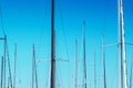 Sailboat masts in harbor against blue sky Royalty Free Stock Photo