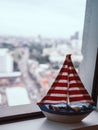 Sailboat model on window.