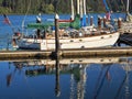 Sailboat moored in harbor Florence Oregon Pacific Coast Siuslaw River with reflections in the water
