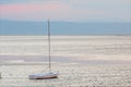 Sailboat moored in the lagoon of the Adriatic Sea, island of the city of Grado. Seascape at dawn.