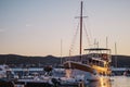 Sailboat moored at pier of Biograd na Moru, Croatia at sunset Royalty Free Stock Photo