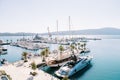 Sailboat is moored to the corner pier next to a motor yacht Royalty Free Stock Photo