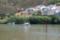 Sailboat and motorboat moored on Rio Guadiana