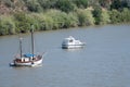 Sailboat and motorboat moored on Rio Guadiana