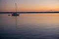 Sailboat Motoring at Sunset on Chesapeake Bay Royalty Free Stock Photo