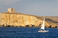 Sailboat navigates inshore in Gozo, Malta