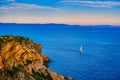 Sailboat navigating in Aegean sea near cape Sounion on sunset, Greece Royalty Free Stock Photo